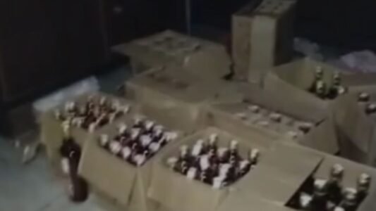Major police crackdown on illicit liquor in Jalandhar; 126 bottles and several crates seized during a raid on a house.